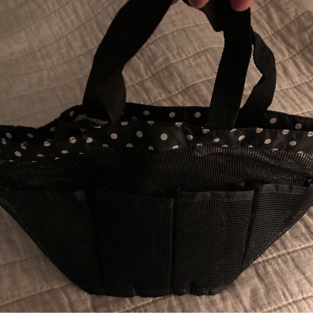 Black mesh shower caddy with polka dot detailing. New & unused.